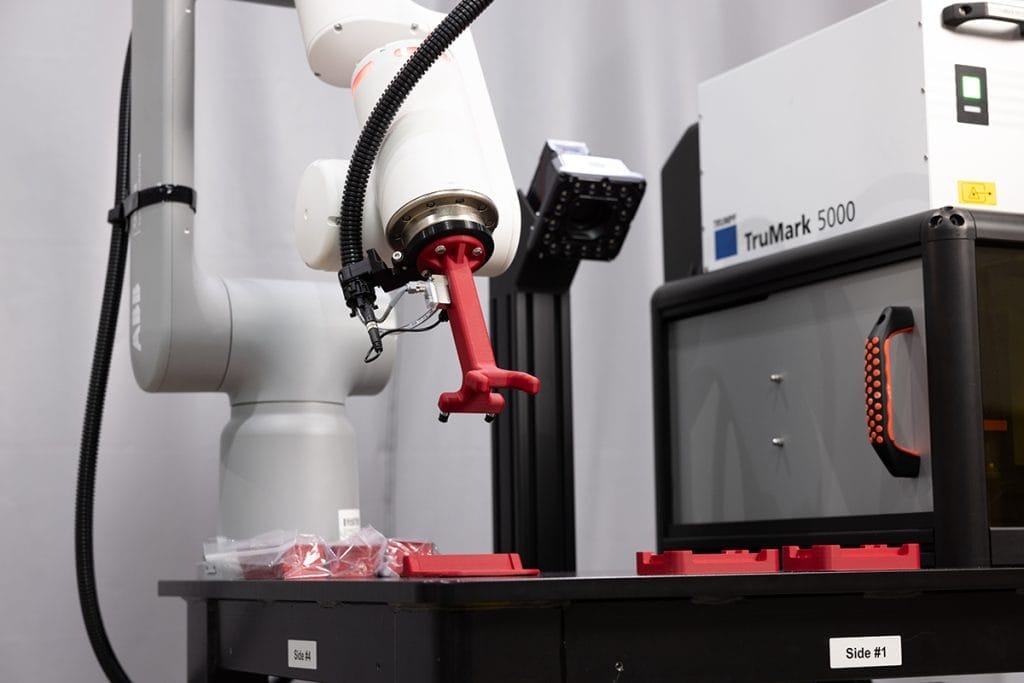 Image of an integrated cobot with TRUMPF TruMark 5010 One-Box Laser system.